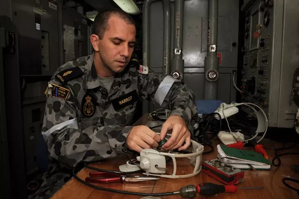 Navy technician performing maintenance