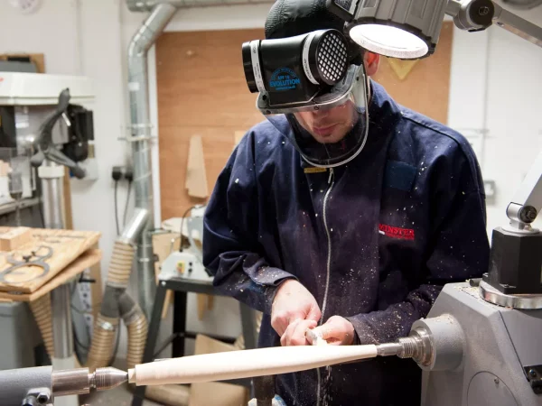 Carpenter using a JSP PowerCap® Active™ Powered Air Respirator